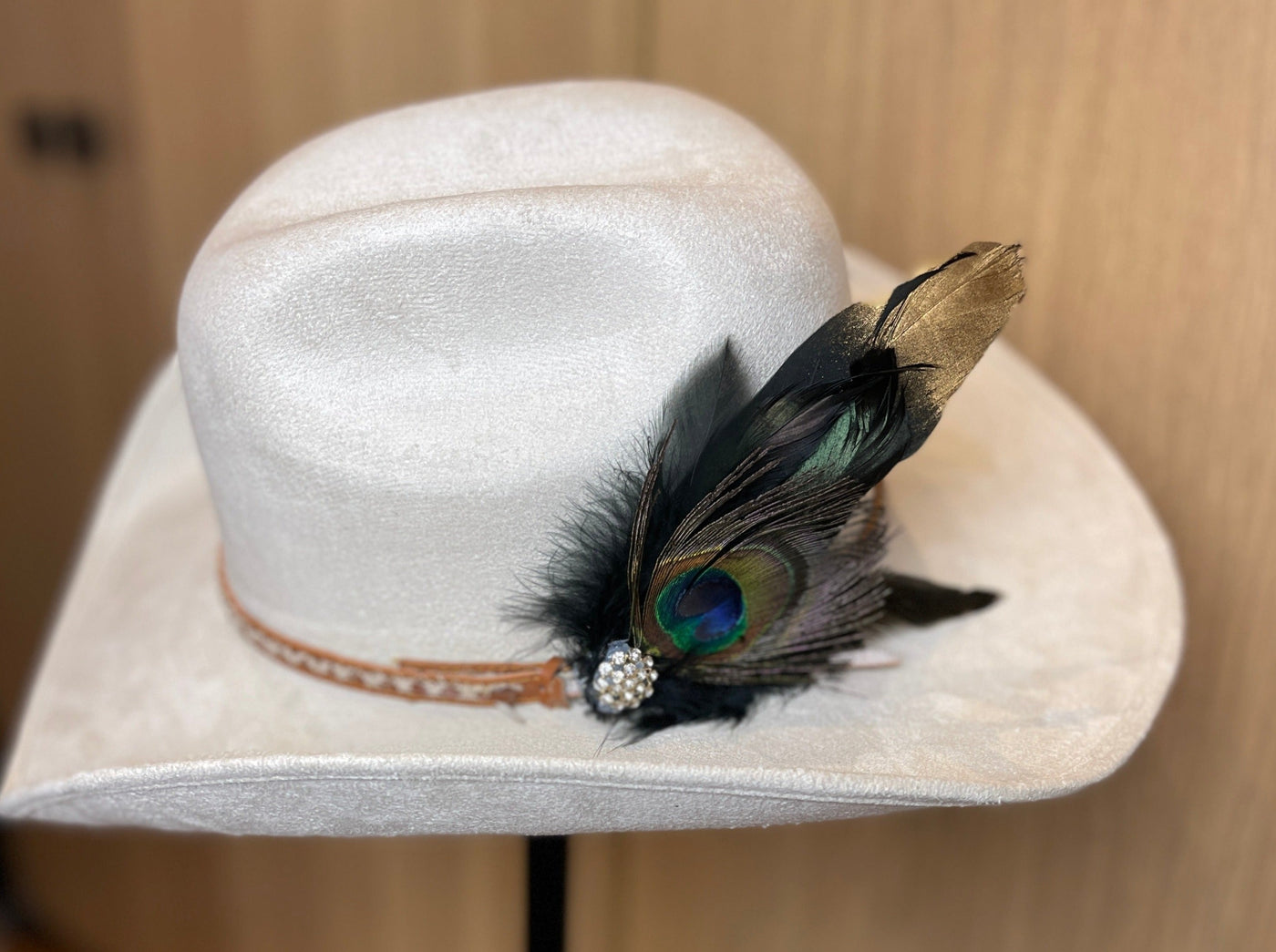 gold dipped crow feather with peacock f feather and silver broach